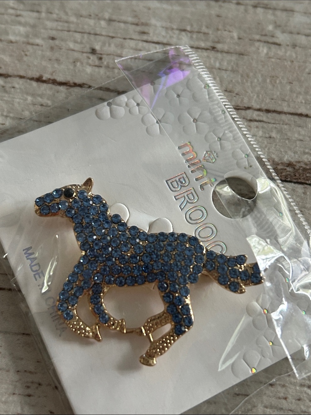 5/)25 Blue Crystal Horse Brooch - Gold Tone